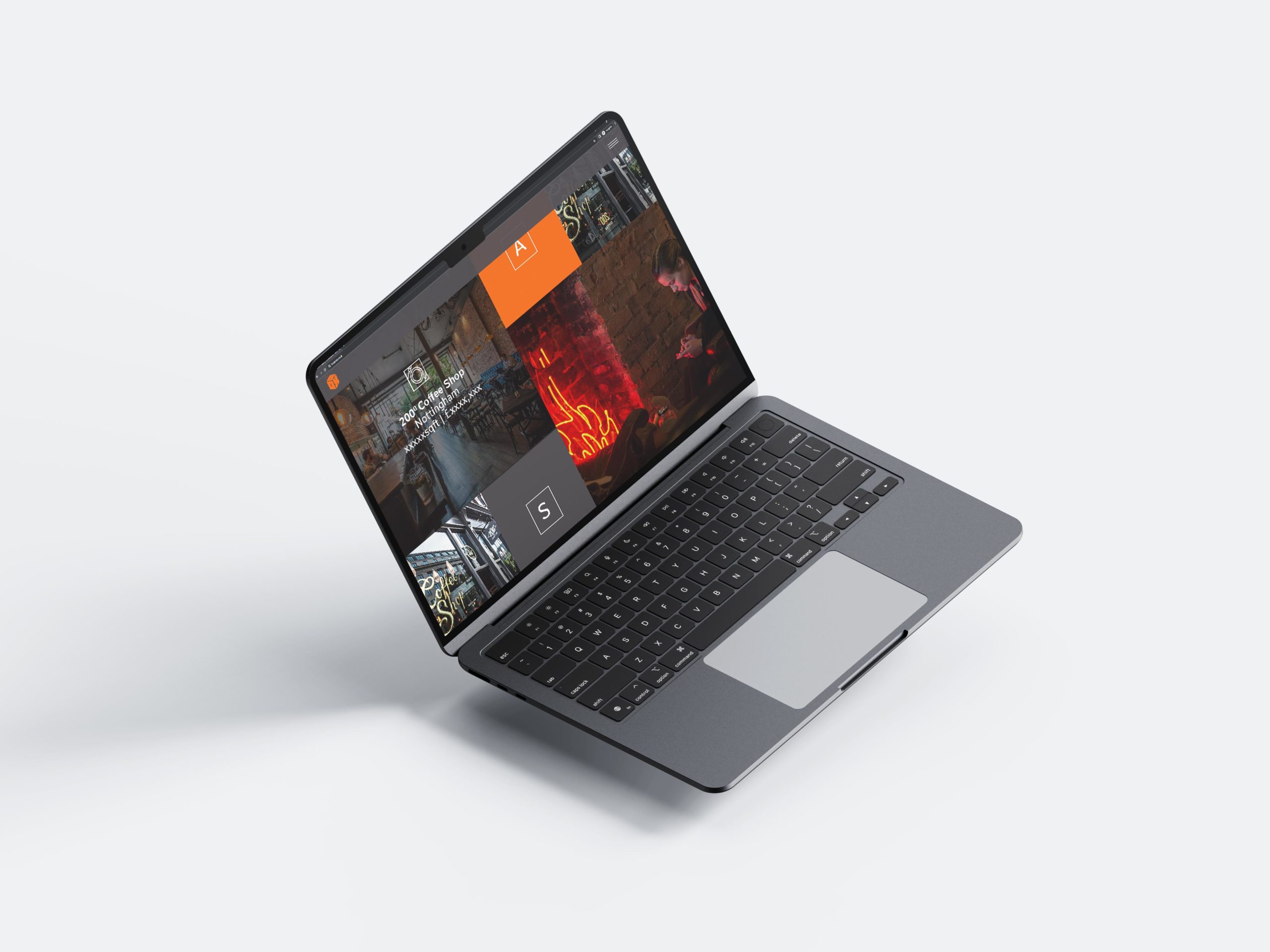 A laptop showcasing the Box Property website design which included a grid feature