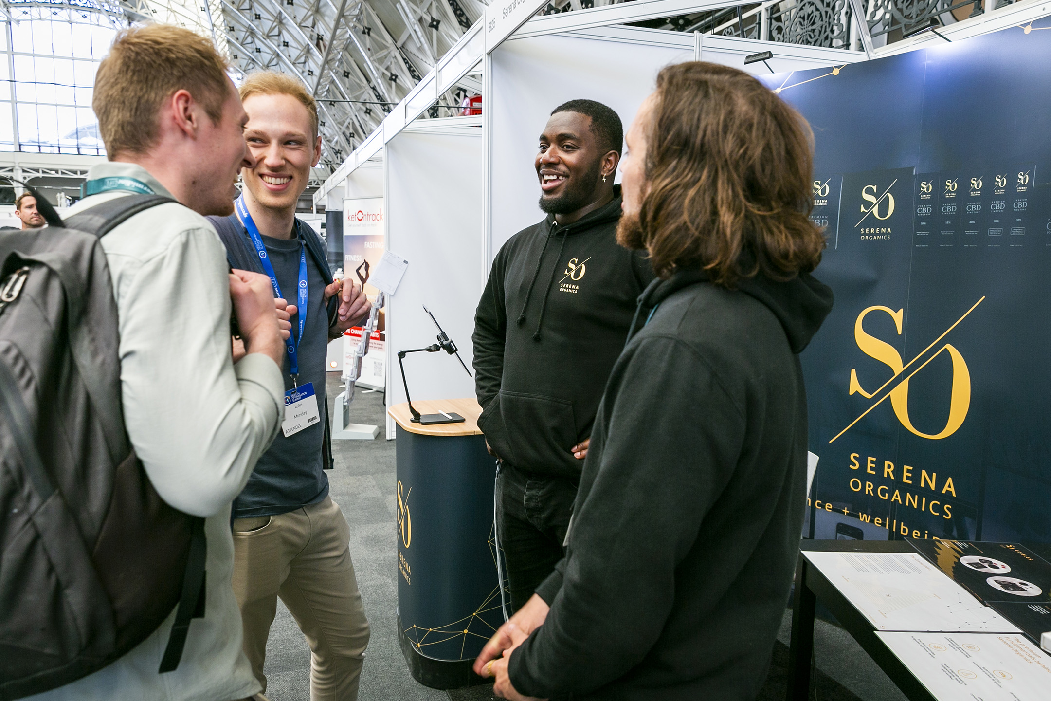 The founders of Serena Organics greeting potential customers in front of the finished exhibition stand