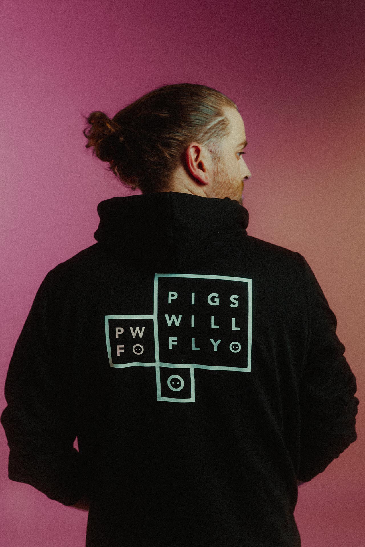 The founder of PWF Studio wearing a branded hoodie